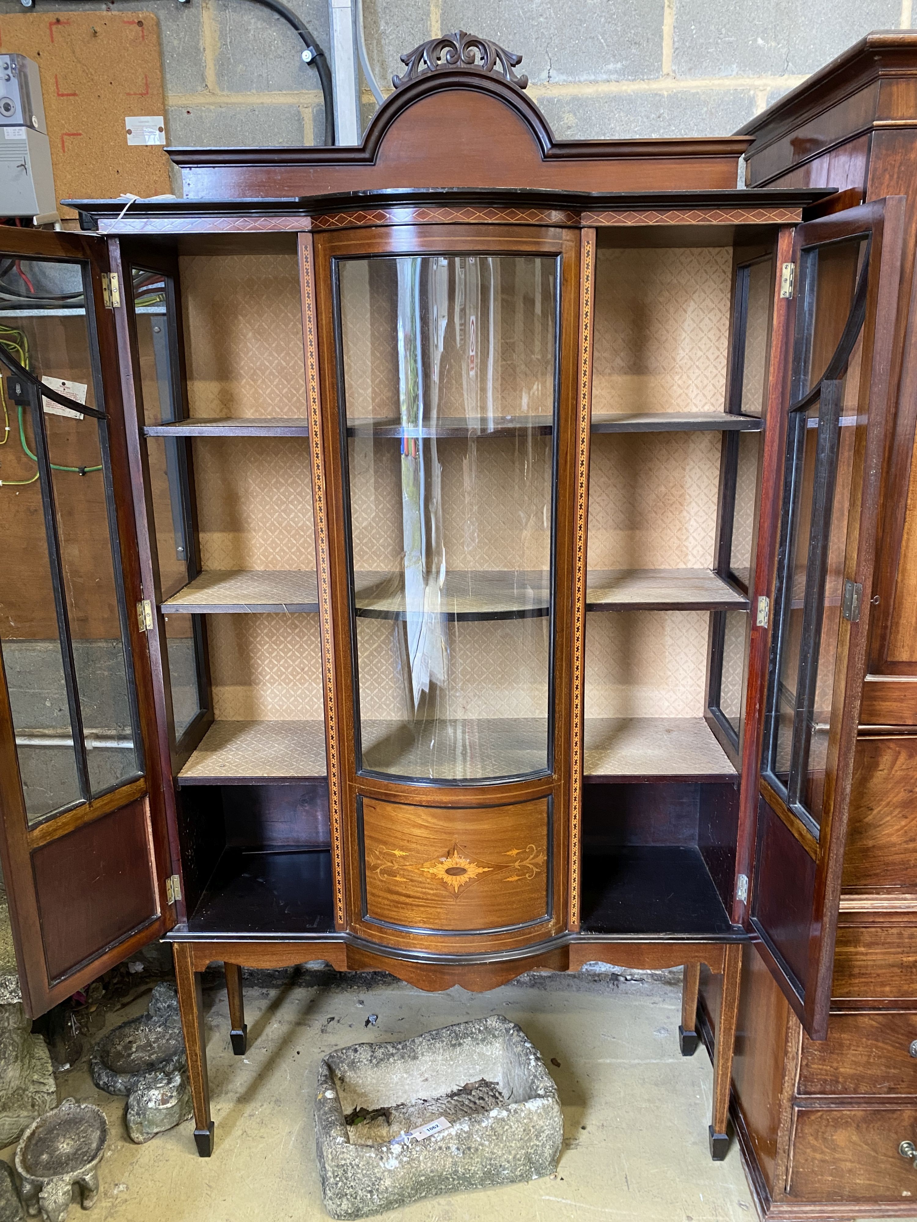 An Edwardian inlaid mahogany bow fronted display cabinet, width 114cm, depth 42cm, height 209cm